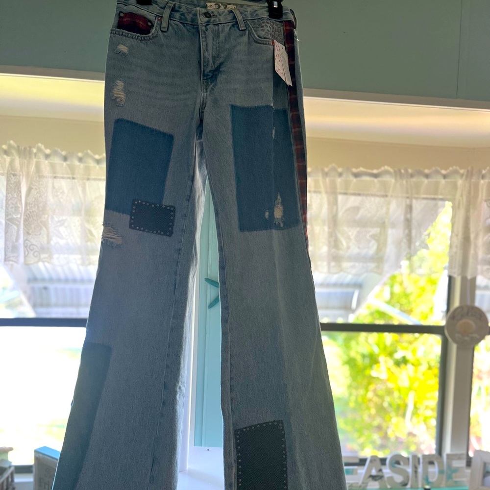 Free People Patchwork Bootcut Jeans. Size 27.